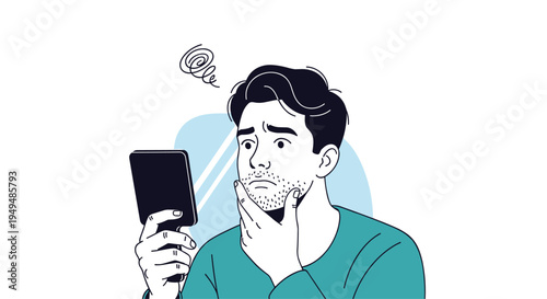 Worried young man looks at his facial stubble in a small hand mirror with a confused and stressed expression on his face.