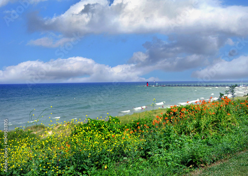 Obraz na plátně Clouds Hover Over Lake Michigan and South Haven Ligththouse