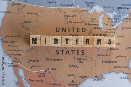 Wooden letter blocks spelling MIDTERMS placed on a map of the United States, representing US midterm elections, political campaigns, and the legislative power balance in Congress