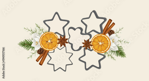 Christmas cookie cutters with dried oranges and cinnamon sticks.