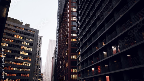 dusk narrow canyon office towers, glowing windows and steel balconies, deep perspective and cinematic grain, rainless haze and warm interior light, late shift