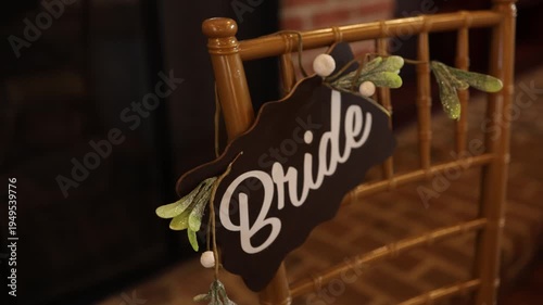 Bride sign on decorated wedding chair