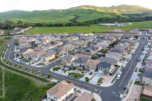Billede på lærred Drone Aerial View of Suburban Housing Development with New Construction Homes, R
