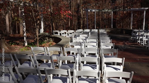 Outdoor wedding ceremony seating in autumn woodland