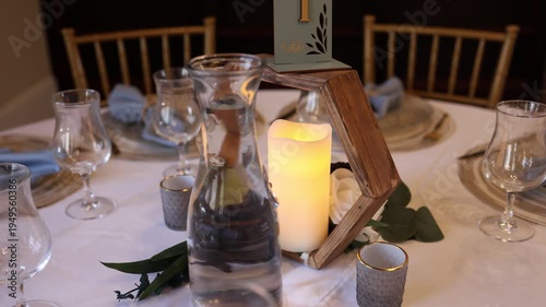 Romantic wedding reception table with candle centerpiece