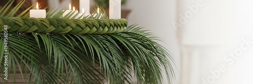 Woven palm frond wreath with white candles for Palm Sunday celebration. Traditional religious holiday decoration, Christian faith observance and solemn church interior background.