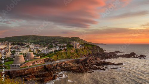 Schilderij op canvas A scenic view of the coastal town of Ilfracombe, North Devon, England from Capstone Hill at sunset