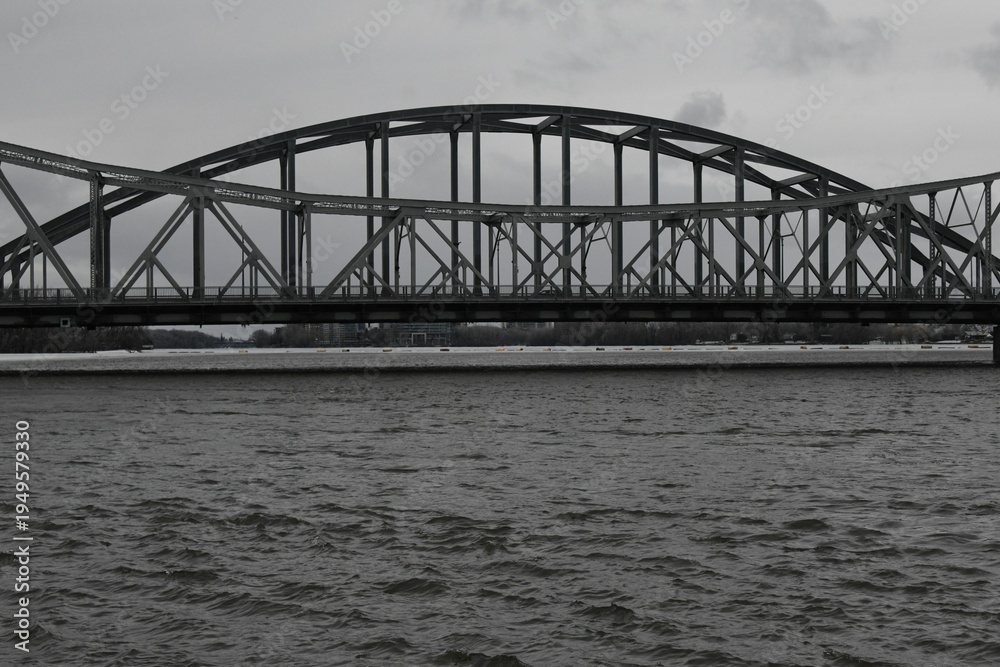 Fototapeta premium Crossing a bridge on a foggy and cold afternoon
