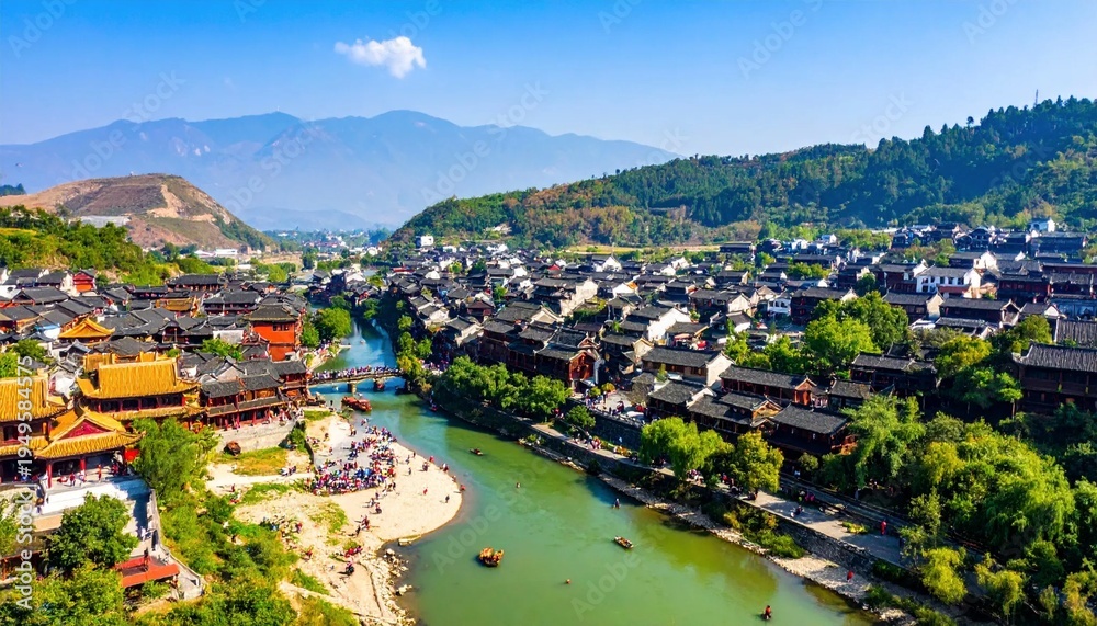Obraz premium Aerial View of Ancient Town with River and Mountains.