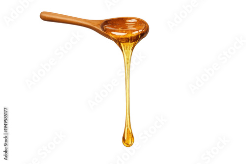 Golden honey dripping from wooden spoon