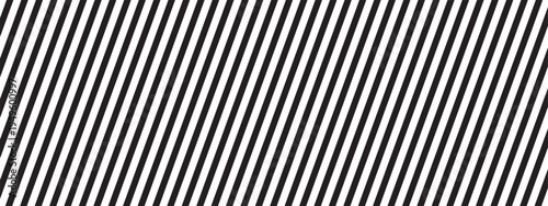 Repeated black diagonal lines on white background. Oblique parallel straight stripes. Tilted striped print. Abstract geometric minimalist design. Vector graphic illustration