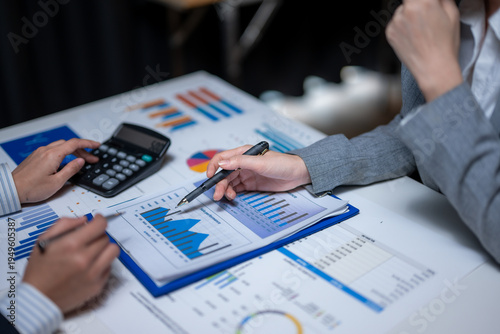 Business colleagues analyzing financial data and sales performance