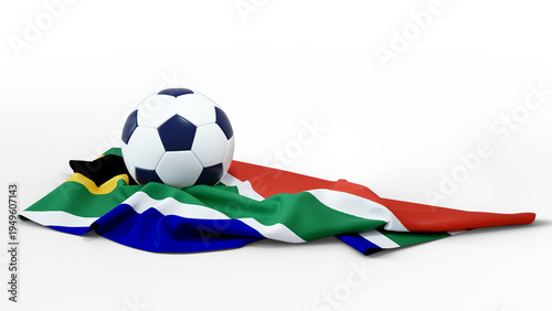A classic black-and-white soccer ball rests atop a draped South African flag. The vibrant green, red, and blue fabric is ruffled against a clean, a transparent background. A minimalist sports shot.
