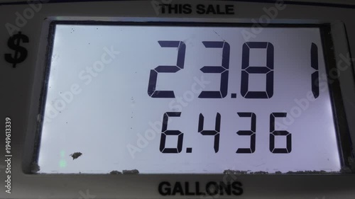 Gas pump display counting the fuel pumped along with the cost in gallons and dollars.