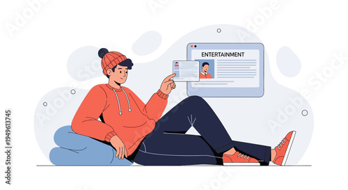 Young man relaxes watching entertainment news on a tablet and laptop