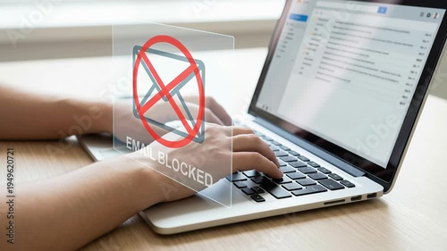 Email blocked alert on laptop keyboard with hands typing showing digital threat warning phishing scam malware protection identity ai cyber attack notification