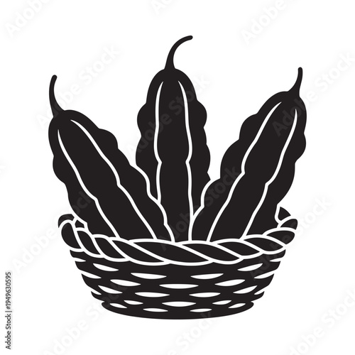 A black silhouette of bitter melons in a woven basket