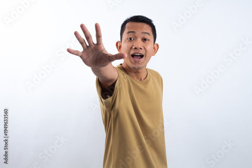 Man extending hand open palm on white background.