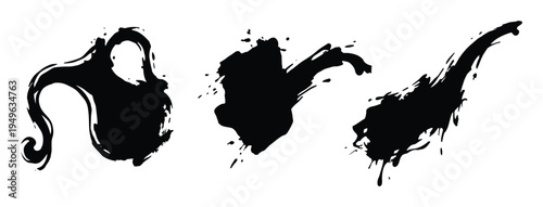 Set of black ink splashes and paint blots for artistic design projects