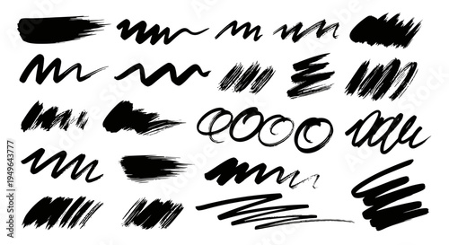 Collection of various black ink brush strokes and scribbles.
