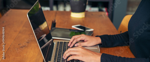 Banner Businesswoman hands type on laptop writing on notebook meeting at office desk. Freelance girl work from home via internet call conference sitting at home office morning time. Close up women