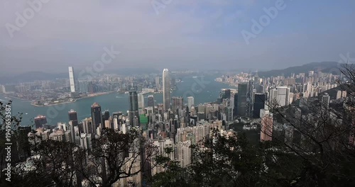 Panoramic sunny daytime view of Hong Kong and Kowloon from Victoria peak