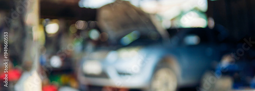 Blur background Mechanic tools engineering equipment car auto repair shop. Blurred background mechanical service. Defocused soft effect vehicle station industrial blurry car garage with copy space