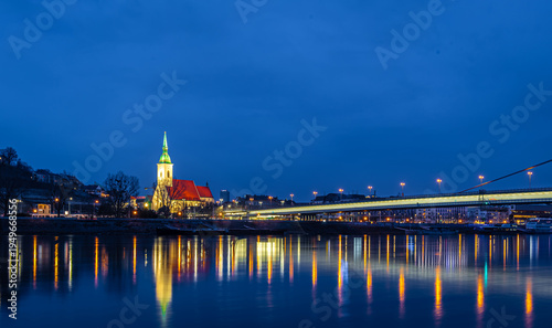 Photography Bratislava night skyline with St Martins Cathedral bridge and reflections
