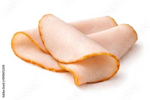 Slices of roasted turkey breast deli meat folded neatly together on plain white background