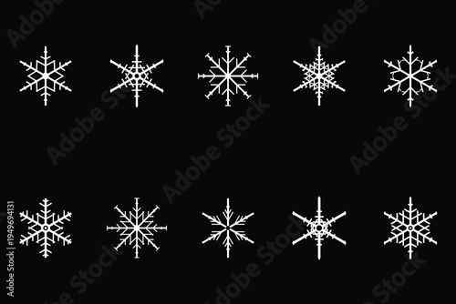 Elegant Snowflake Symphony: An artful arrangement of delicate snowflakes dance gracefully against a stark, black backdrop, creating a captivating display of winter's unique beauty. 