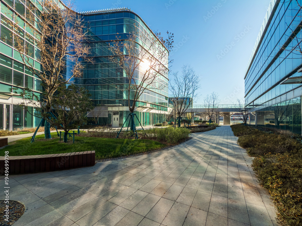 Naklejka premium Inviting Urban Landscape with Modern Architecture and Lush Greenery
