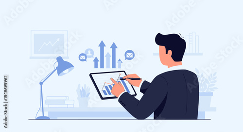 Businessman analyzing data on tablet at desk.