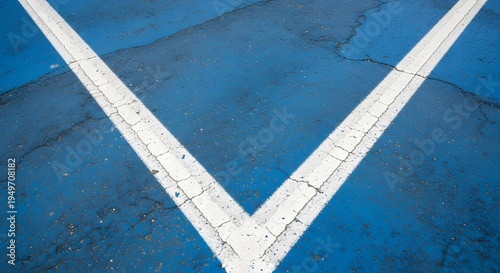 A white chevron on a blue surface