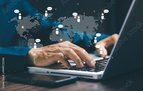 Business professional working on laptop with digital world map and communication icons connecting people globally. Concept of global business network, online communication, remote collaboration