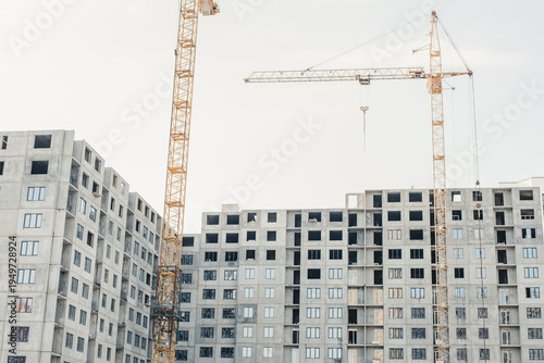 building under construction. New building. House under construction. Construction site. House under construction and a crane.