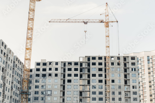 building under construction. New building. House under construction. Construction site. House under construction and a crane.