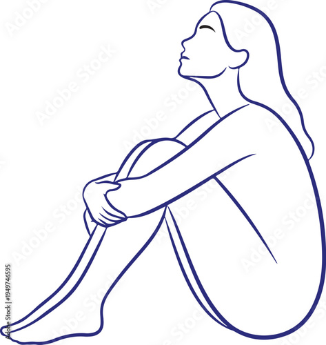 Woman sitting with knees hugged to chest looking up