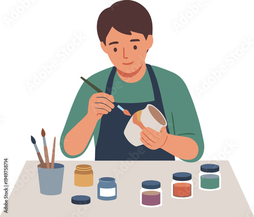 Person painting colorful design on pottery at table with jars