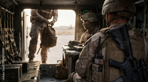 Fotografía Armed soldiers in desert camouflage gear inside a military transport vehicle during a sunrise mission