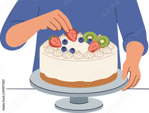 A person decorates a cake with strawberries on a table indoors