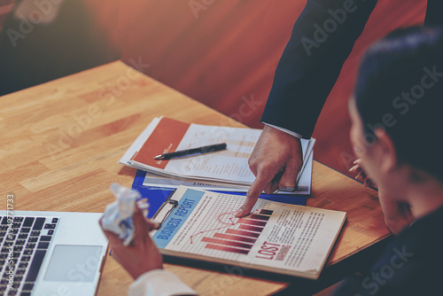 Talking about serious business. Business peoples meeting, discuss about business problem and bad business result. Selected focus