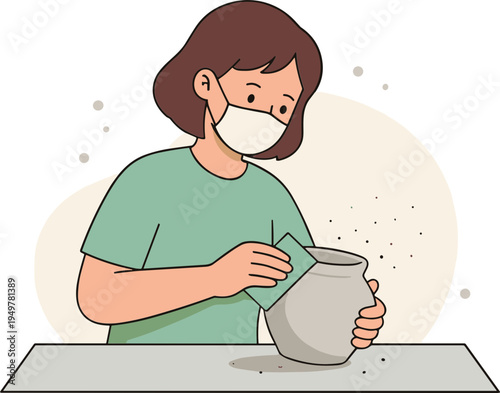 Woman wearing a mask carefully handles a dusty vase on a table indoors.