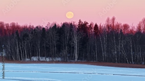 Wallpaper Mural Blood moon merge pink sunset over leafless forest, car parked on frozen lake with open bonnet - aerial 4k Torontodigital.ca