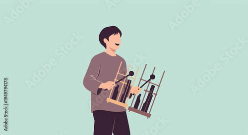 A person plays a xylophone-like instrument against a plain background