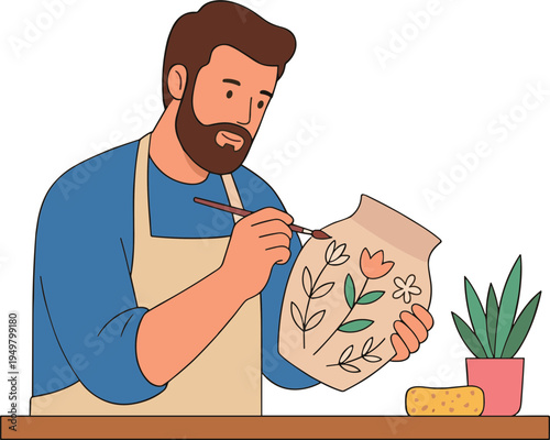 A man painting a floral design on a ceramic vase with a brush.