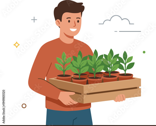 Man holding a box of potted green plants smiling indoors