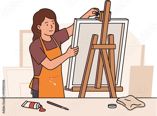 A woman paints on a canvas standing on an easel in a studio