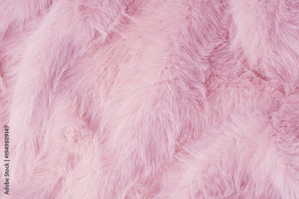 Obraz premium Soft fluffy light pink fabric texture background with abstract luxurious wavy plush material