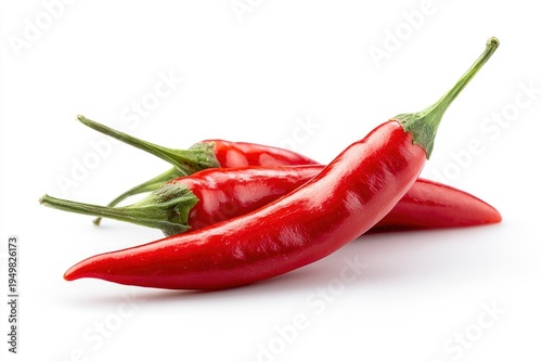 Fresh red chili peppers on white.