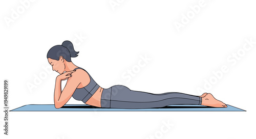 Woman in yoga attire performs a prone backbend on a blue mat